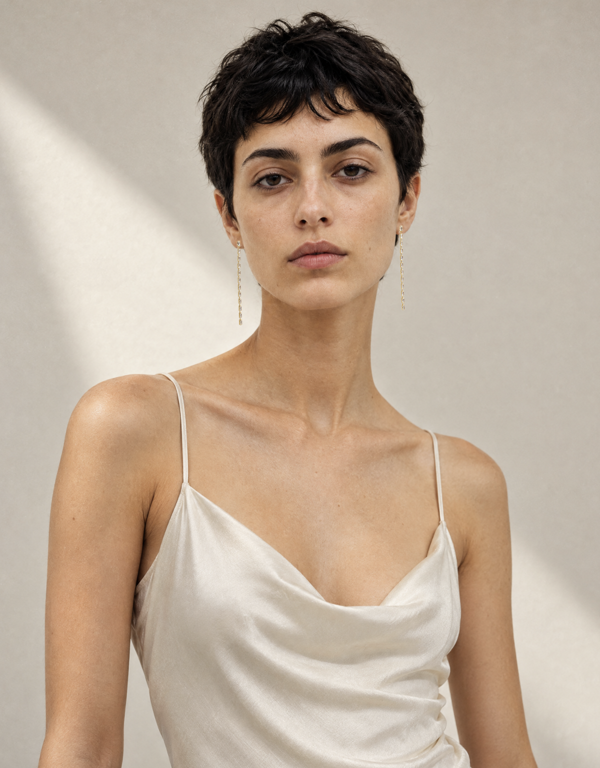 Baguette Crystal Chain Earrings by Dear Neighbor worn with a slip dress, long gold crystal drop