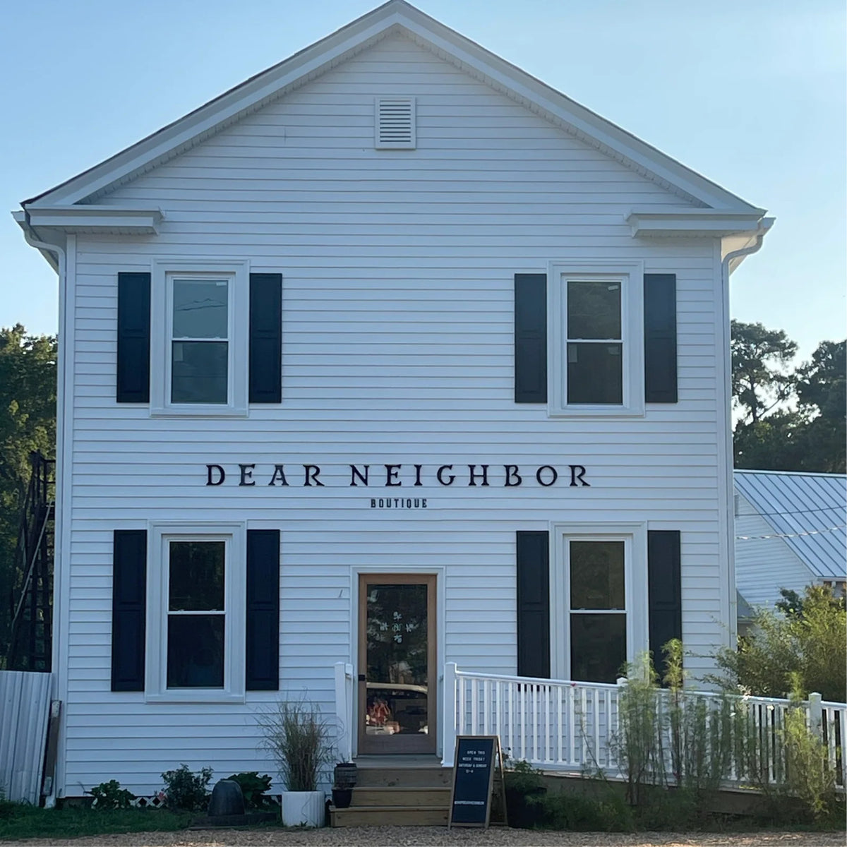 Dear Neighbor Irvington, a white two-story shop on King Carter Drive, Irvington VA