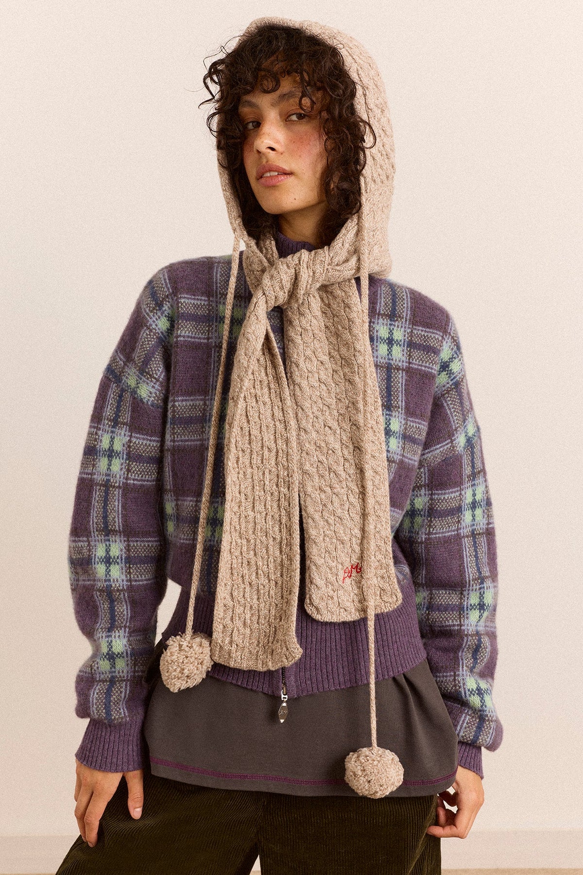 Hooded Pom Pom Scarf in Oatmeal Marl, hood up and scarf hanging loose, on model