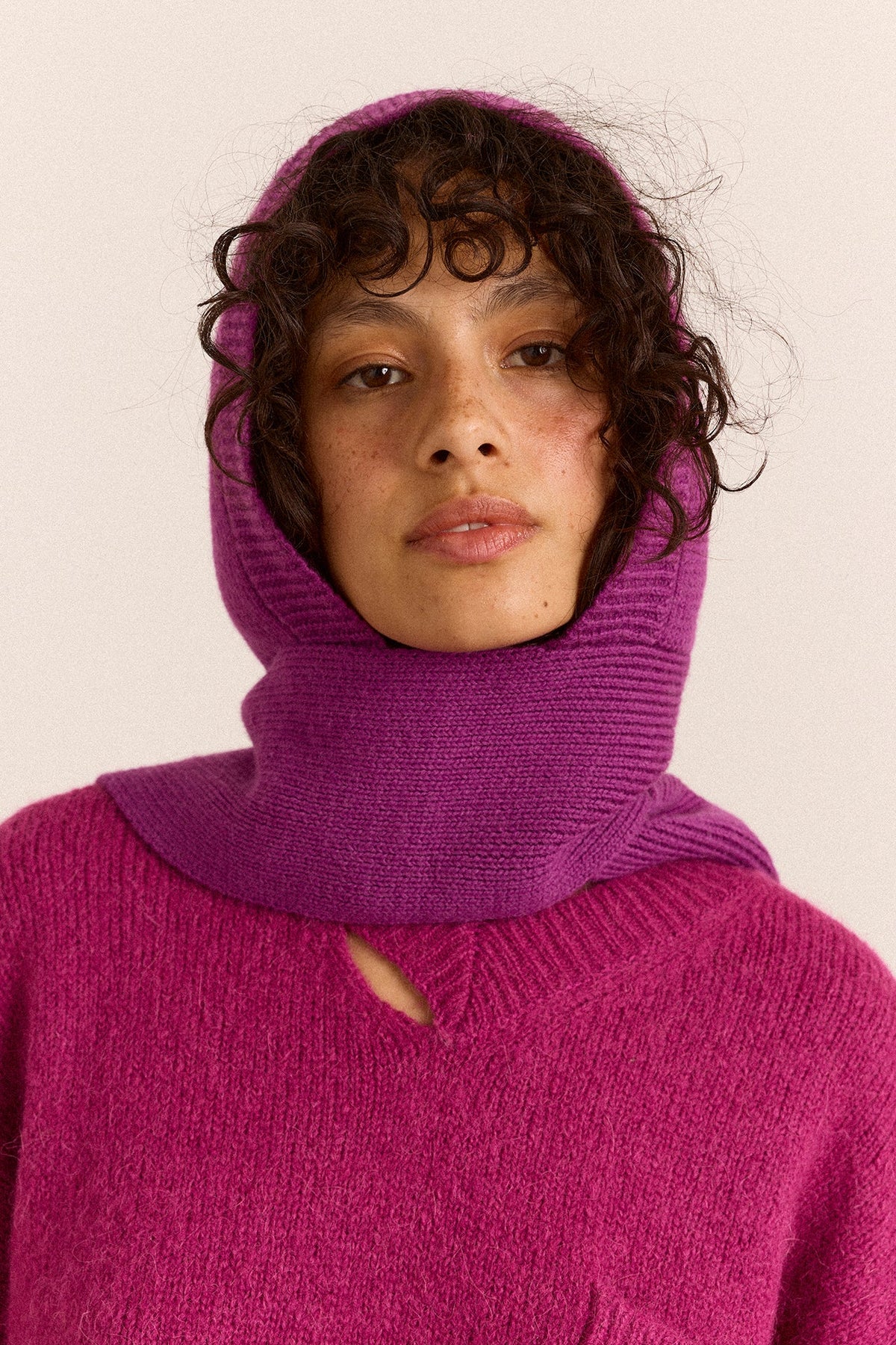 Tassel Hooded Scarf in Magenta, front view on model