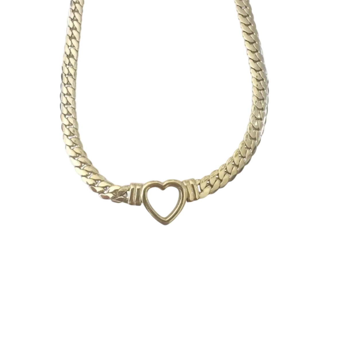 Gold chain necklace with a heart-shaped clasp on a white background