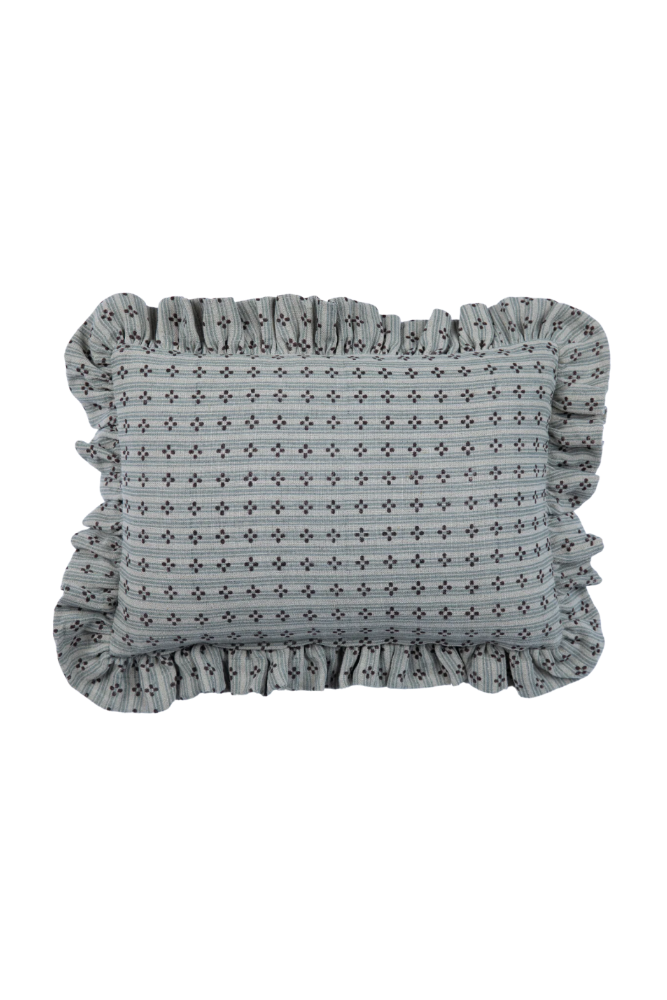 Decorative pillow with ruffled edge and geometric pattern on a white background