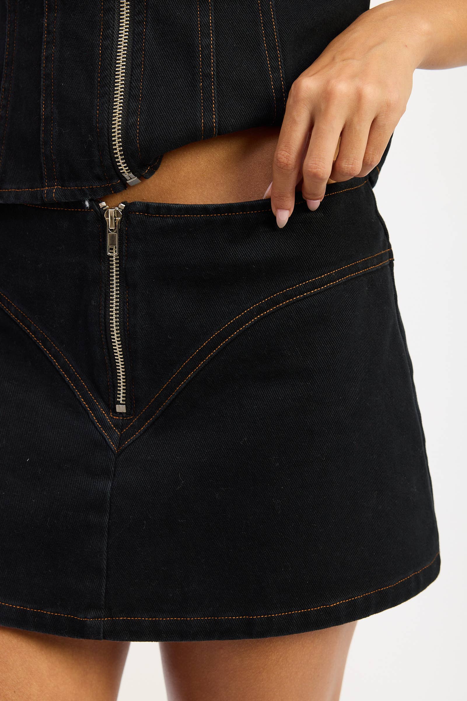 Row Rise Mini Skirt with Zip Closure in Black