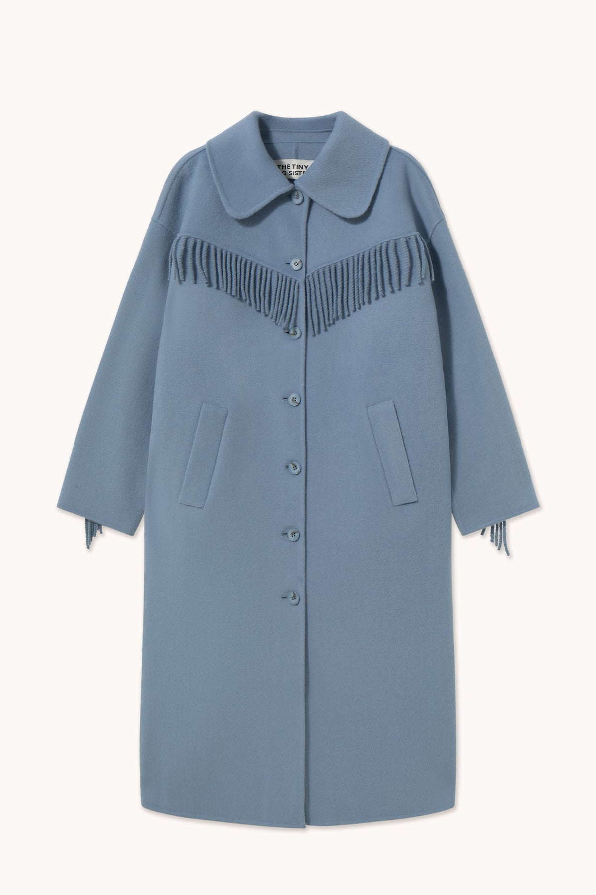 Frills Long Coat in Washed Blue by The Tiny Big Sister — flat front view showing the fringe yoke