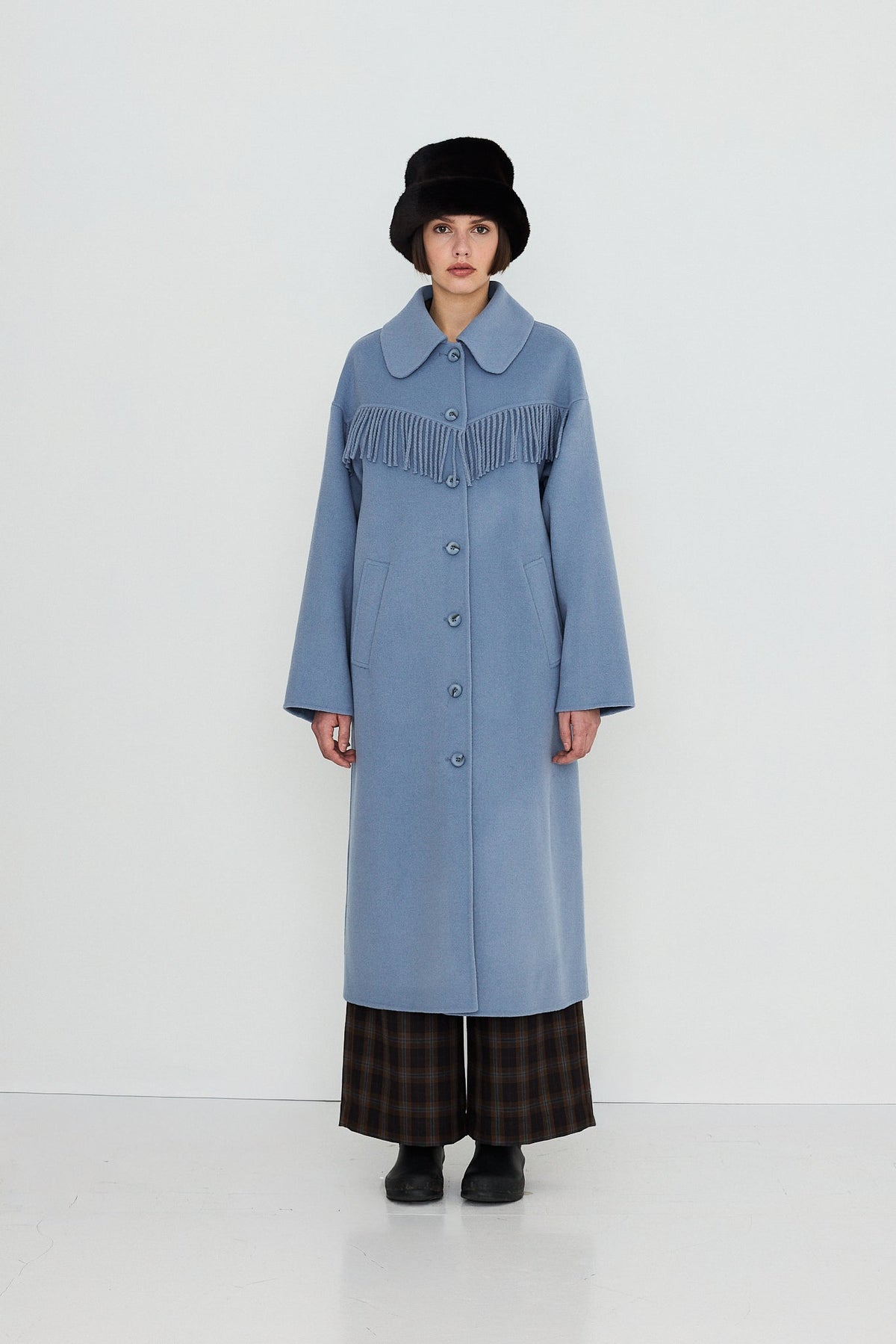 Frills Long Coat in Washed Blue by The Tiny Big Sister — full-length front view on model