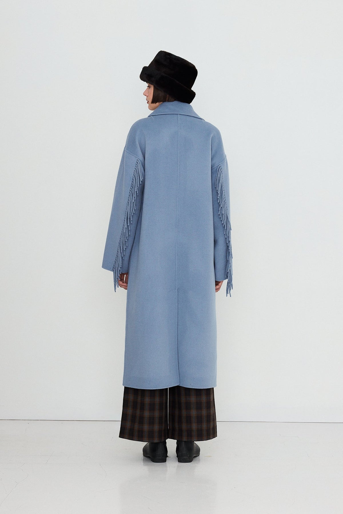 Frills Long Coat in Washed Blue by The Tiny Big Sister — back view on model