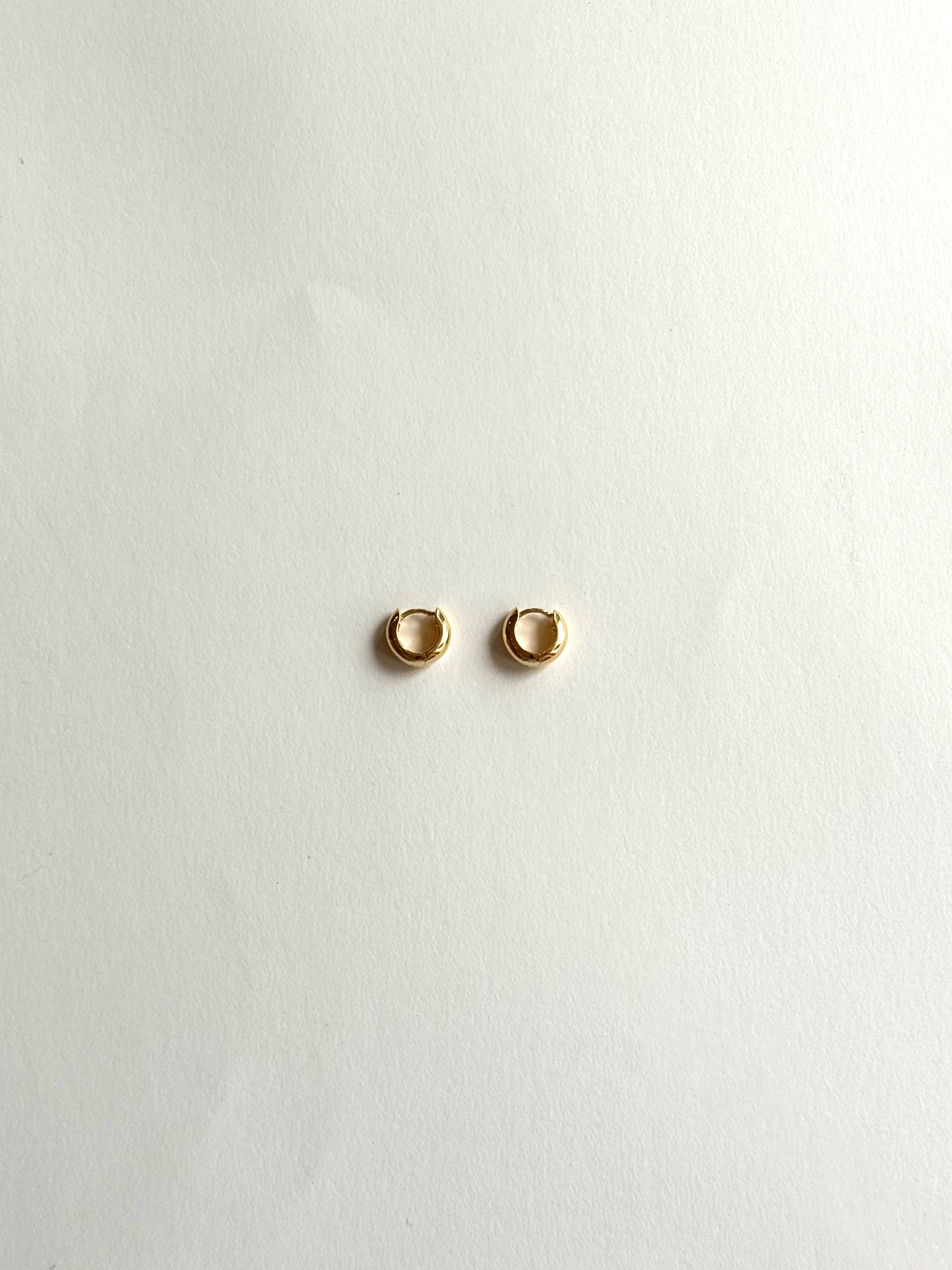 14k Bold Mini Huggie Hoops — front view