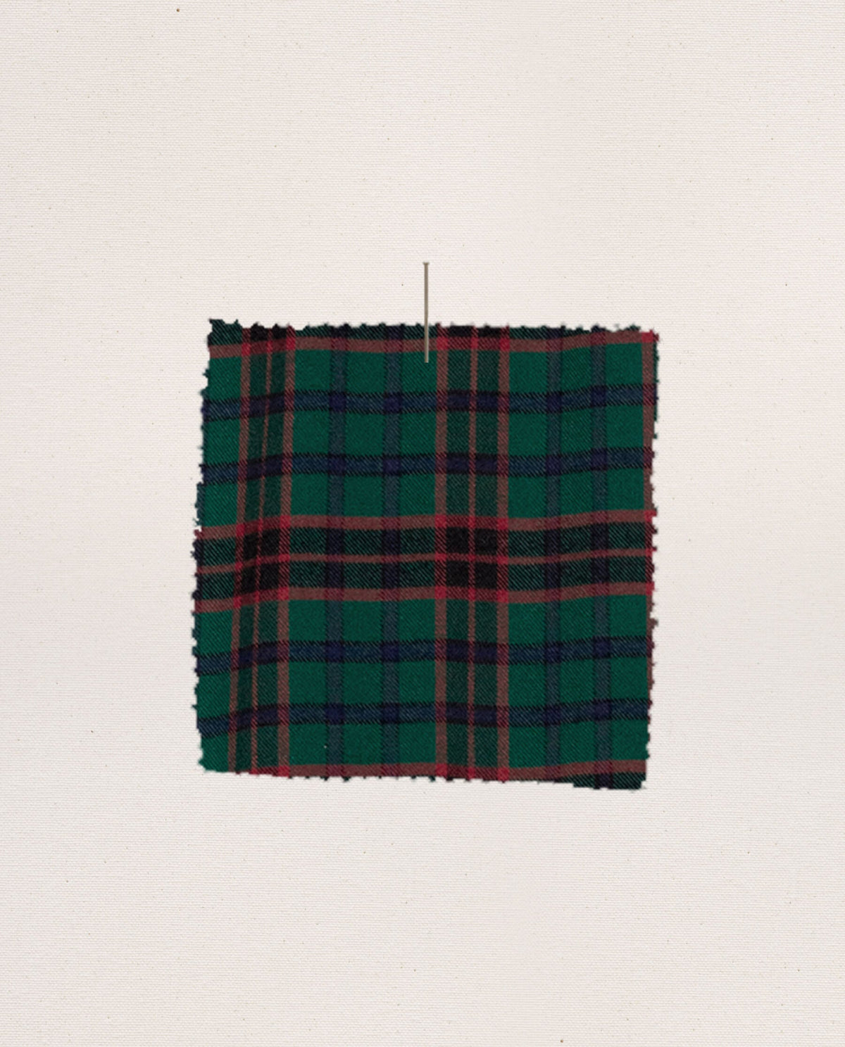 Lodge plaid flannel fabric swatch in green and red