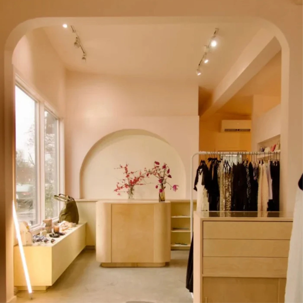 Inside Dear Neighbor Richmond: arched alcove and clothing racks