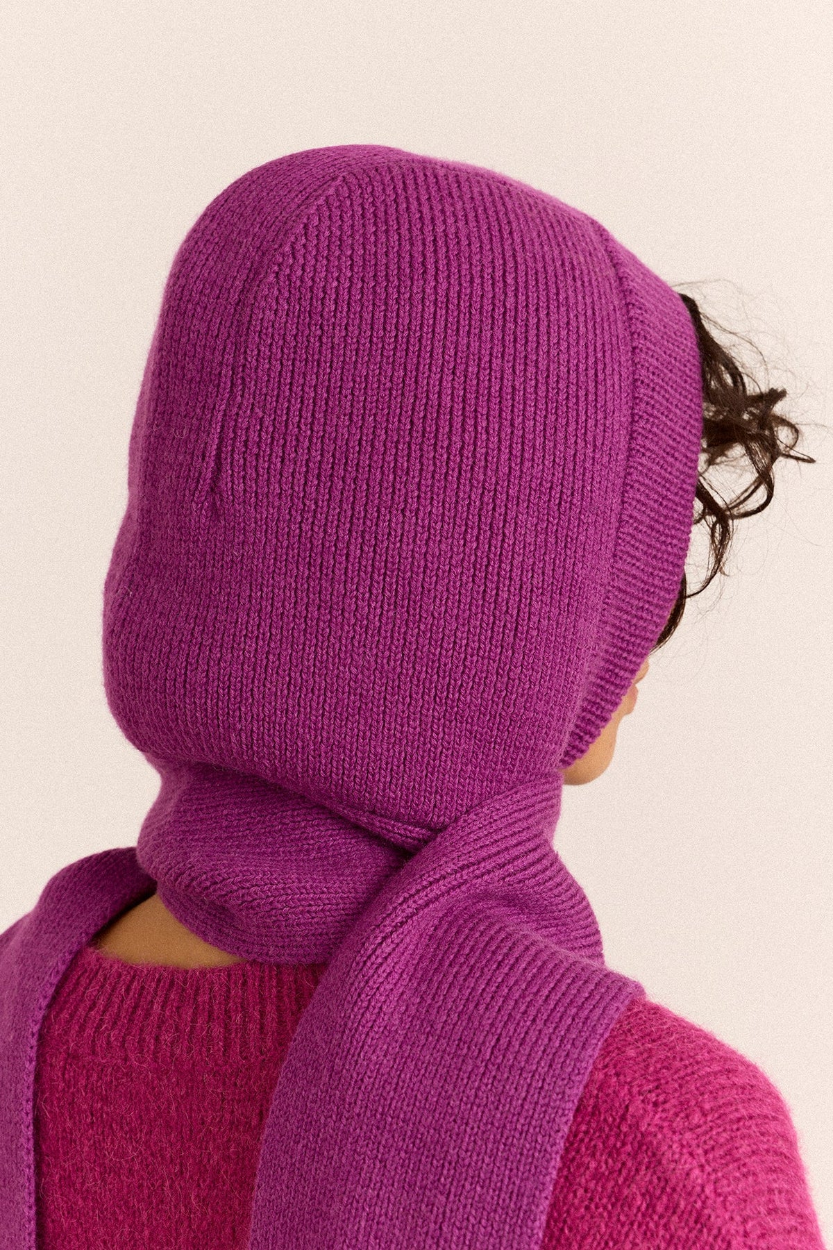 Tassel Hooded Scarf in Magenta, side view of the hood
