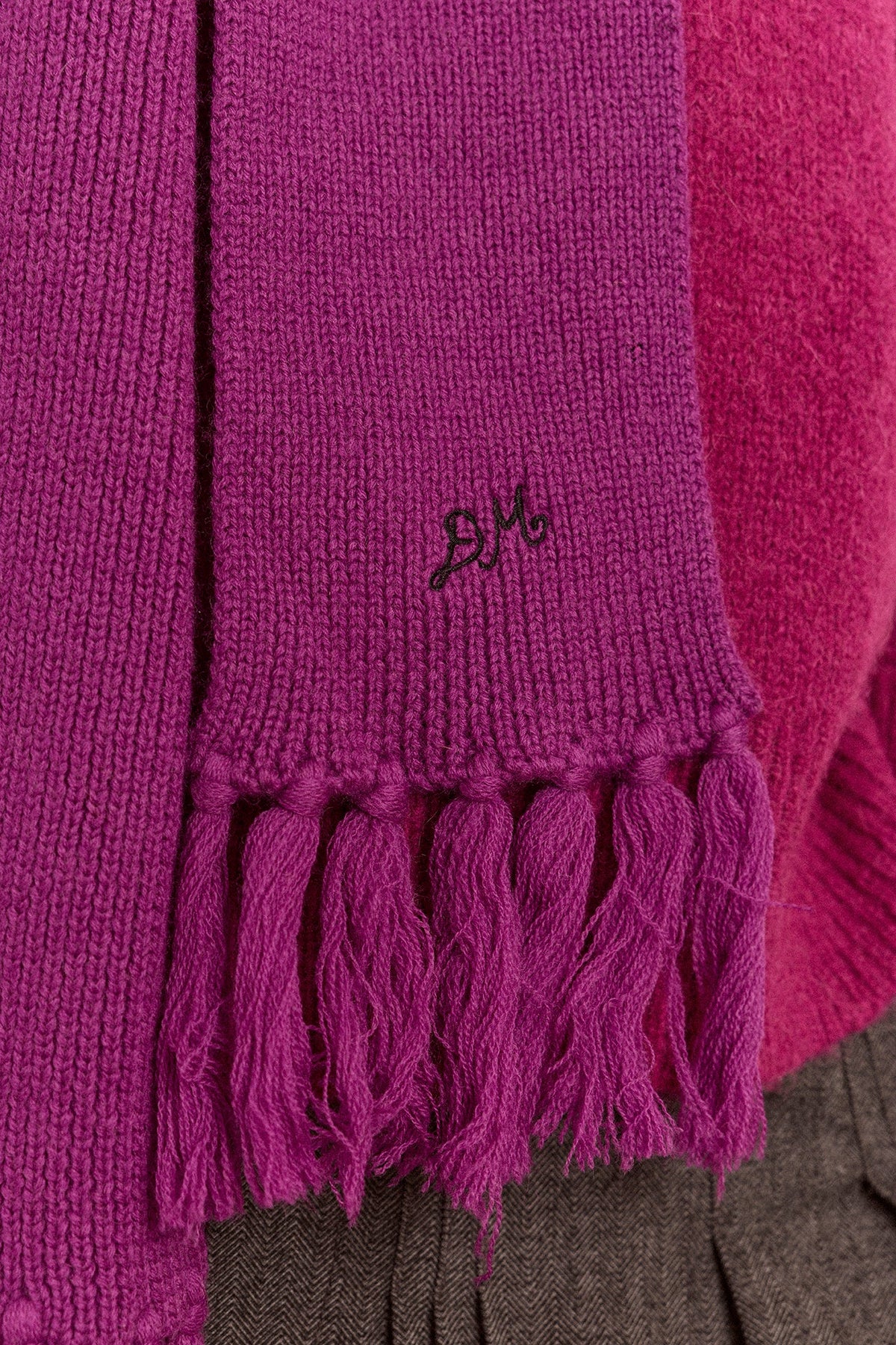 Tassel Hooded Scarf in Magenta, detail of the tassel fringe and embroidery