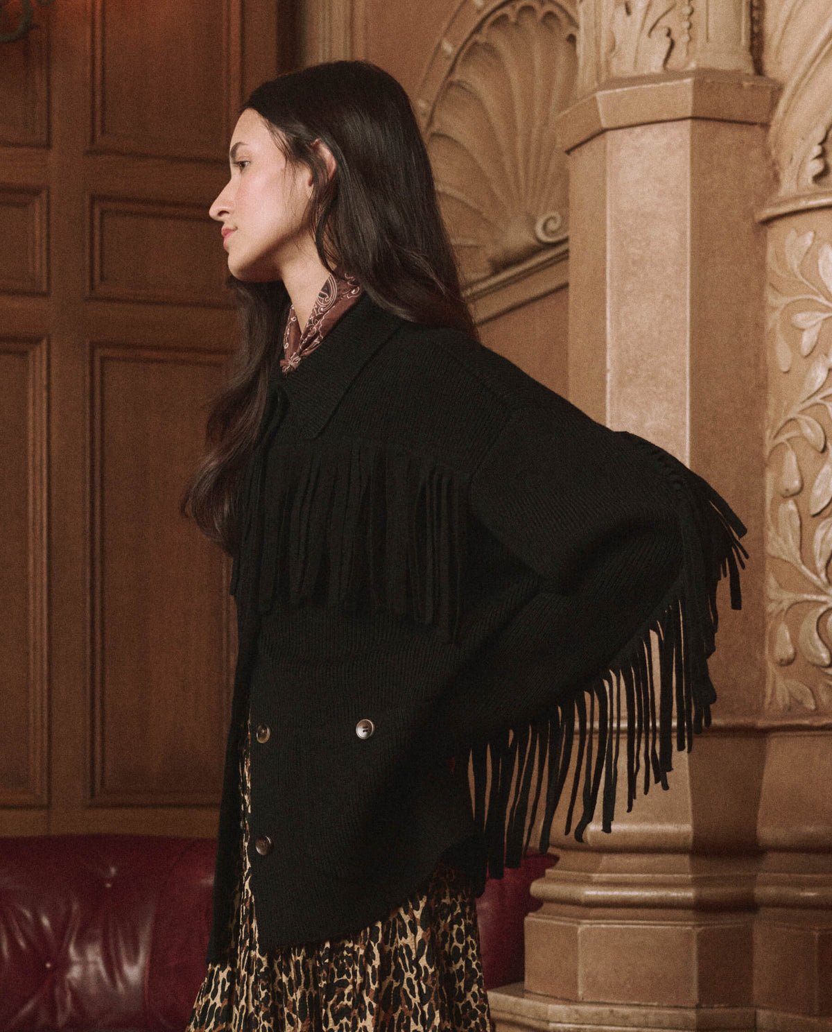 The Western Fringe Sweater Jacket in Black by The Great — side view showing the fringe