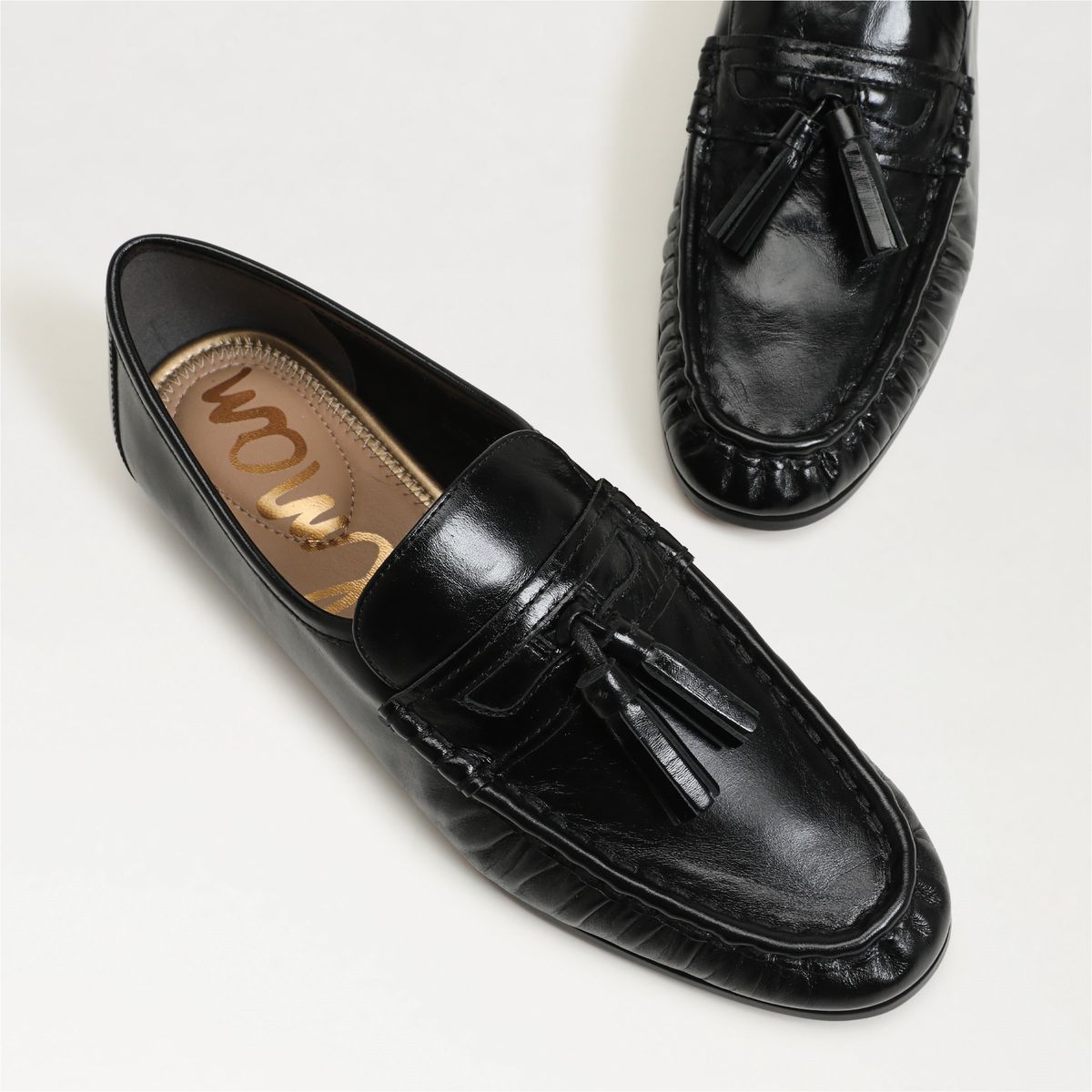 Lana Tassel Loafer in Black by Sam Edelman — close-up of the tassel and woven leather